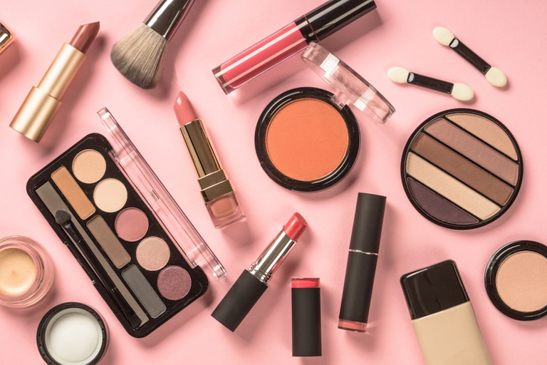 Make,Up,Products,At,Pink,Background,Top,View.